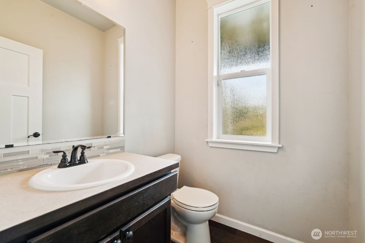 4335 Dudley Drive Northeast Lacey, WA 98516 - Photo 32 of 39 a bathroom with a sink and a toilet