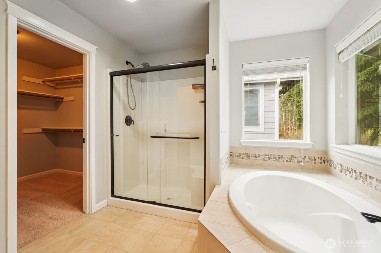 4335 Dudley Drive Northeast Lacey, WA 98516 - Photo 34 of 39 a bathroom with a tub and a sink