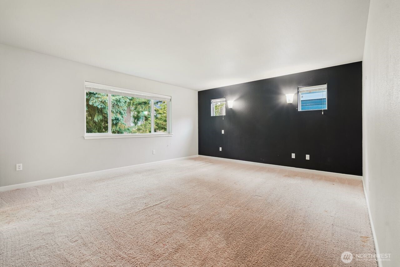 4335 Dudley Drive Northeast Lacey, WA 98516 - Photo 36 of 39 a view of an empty room with window and a projector screen