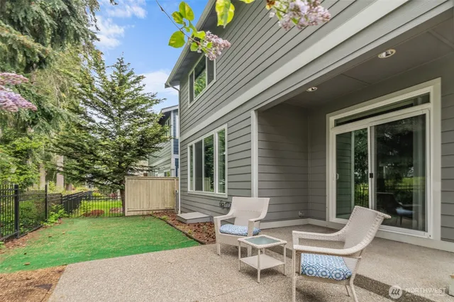 a view of a patio with a table and chairs