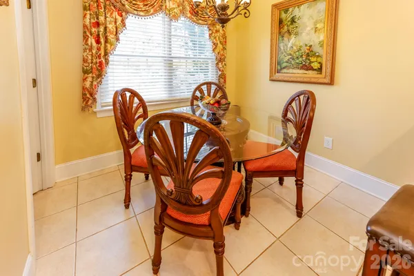 a view of a dining room with furniture and window