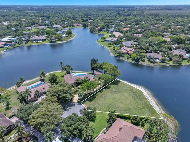 an aerial view of a house with a lake view