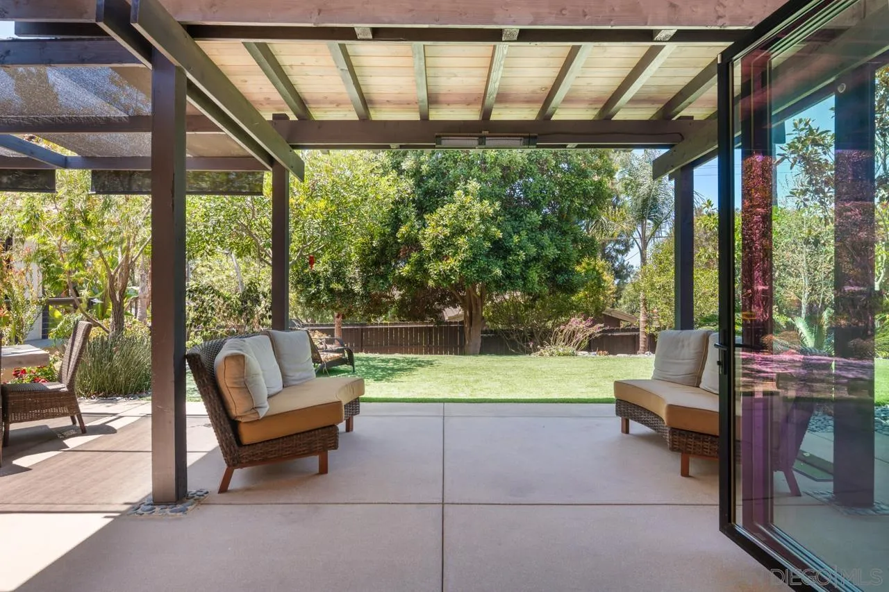 1180 Devonshire Drive Encinitas, CA 92024 - Photo 13 of 53 a living room with furniture and a floor to ceiling window