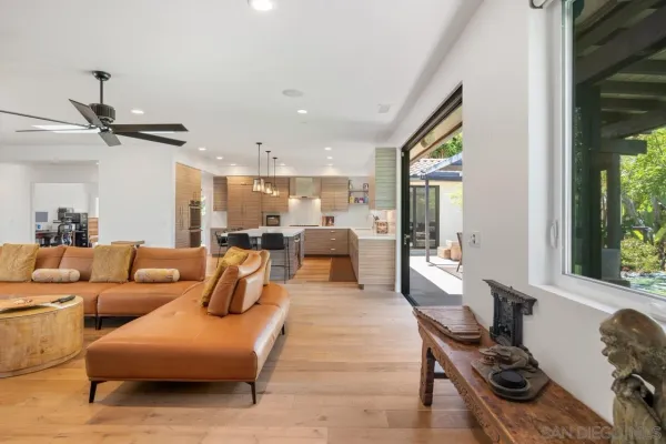 a spacious bedroom with a bed and a large window