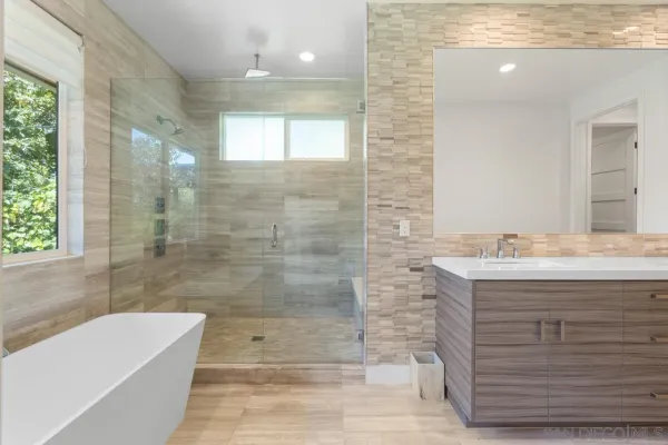 a bathroom with a bathtub and shower