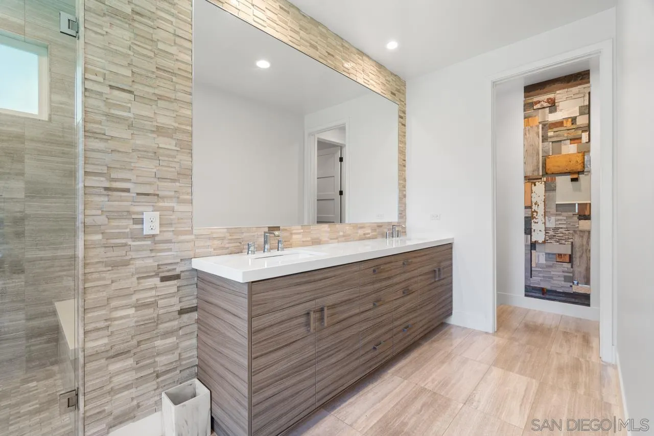 1180 Devonshire Drive Encinitas, CA 92024 - Photo 29 of 53 a bathroom with a sink and a mirror