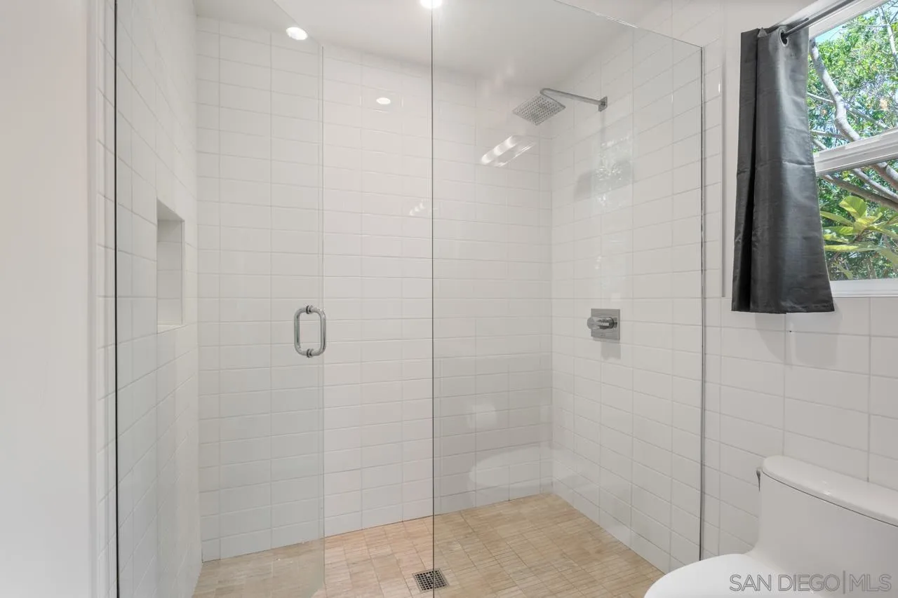 1180 Devonshire Drive Encinitas, CA 92024 - Photo 37 of 53 a bathroom with a shower and toilet