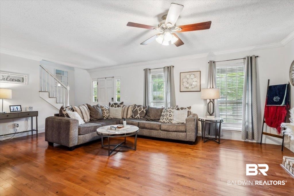 3616 Vista Ridge Drive Mobile, AL 36693 - Photo 3 of 20 Living room featuring ceiling fan, wood-type flooring, a textured ceiling, and plenty of natural light