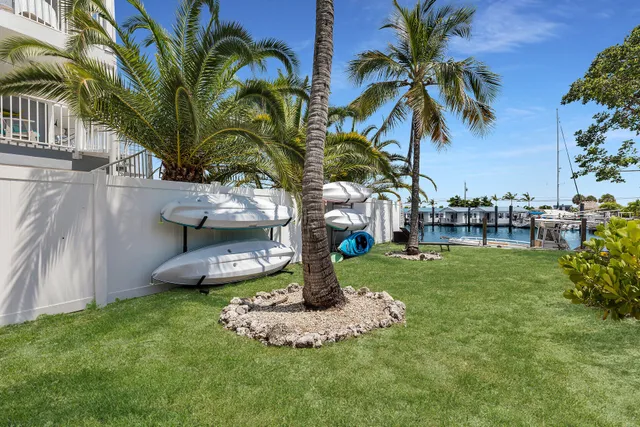 a roof deck with table and chairs a barbeque