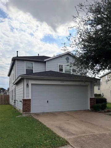 a front view of a house with a garage