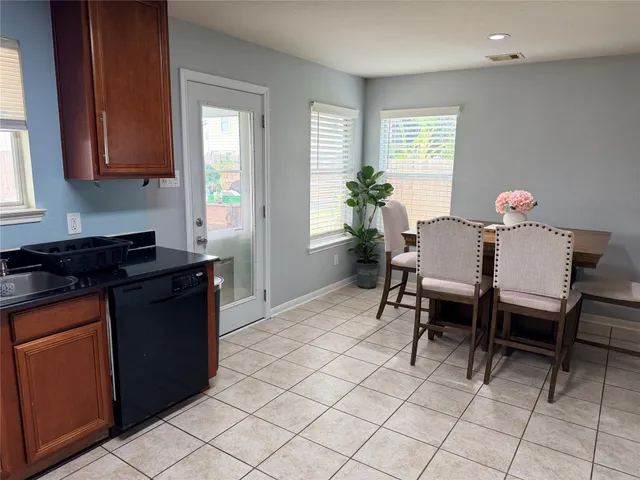 a kitchen with a table and chairs in it