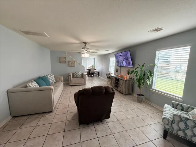 a living room with furniture and a window