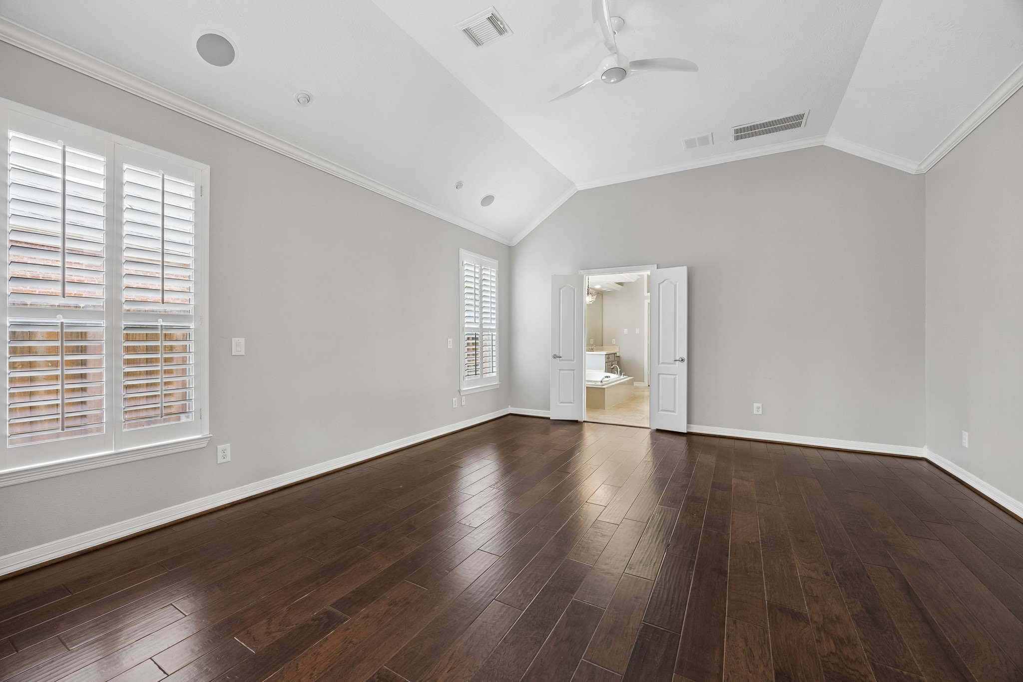 6331 Collina Springs Court Houston, TX 77041 - Photo 14 of 34 a view of an empty room with wooden floor and a window