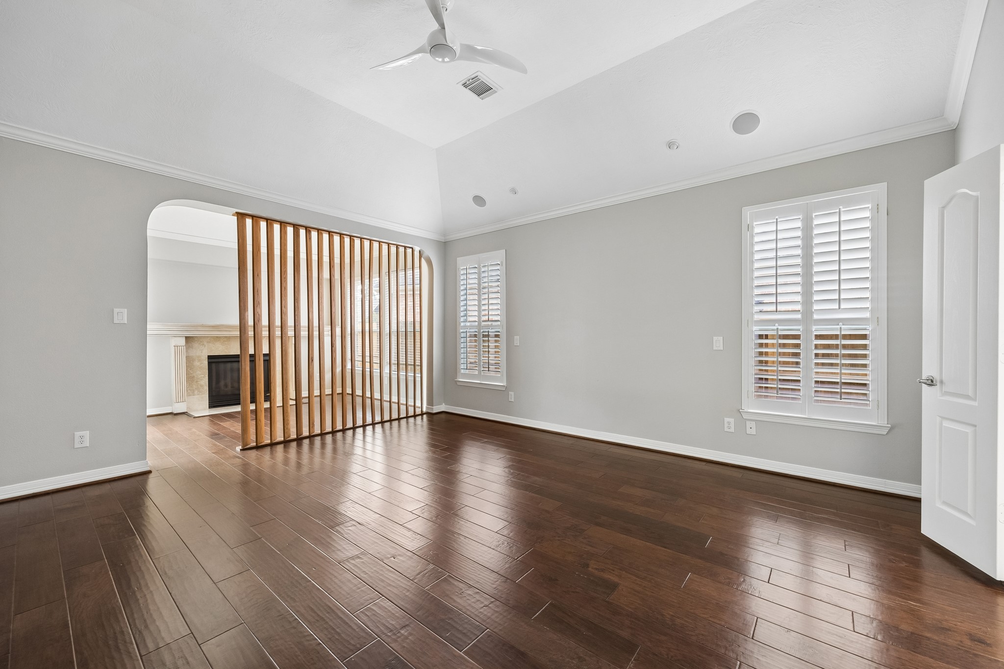 6331 Collina Springs Court Houston, TX 77041 - Photo 15 of 34 an empty room with wooden floor and windows