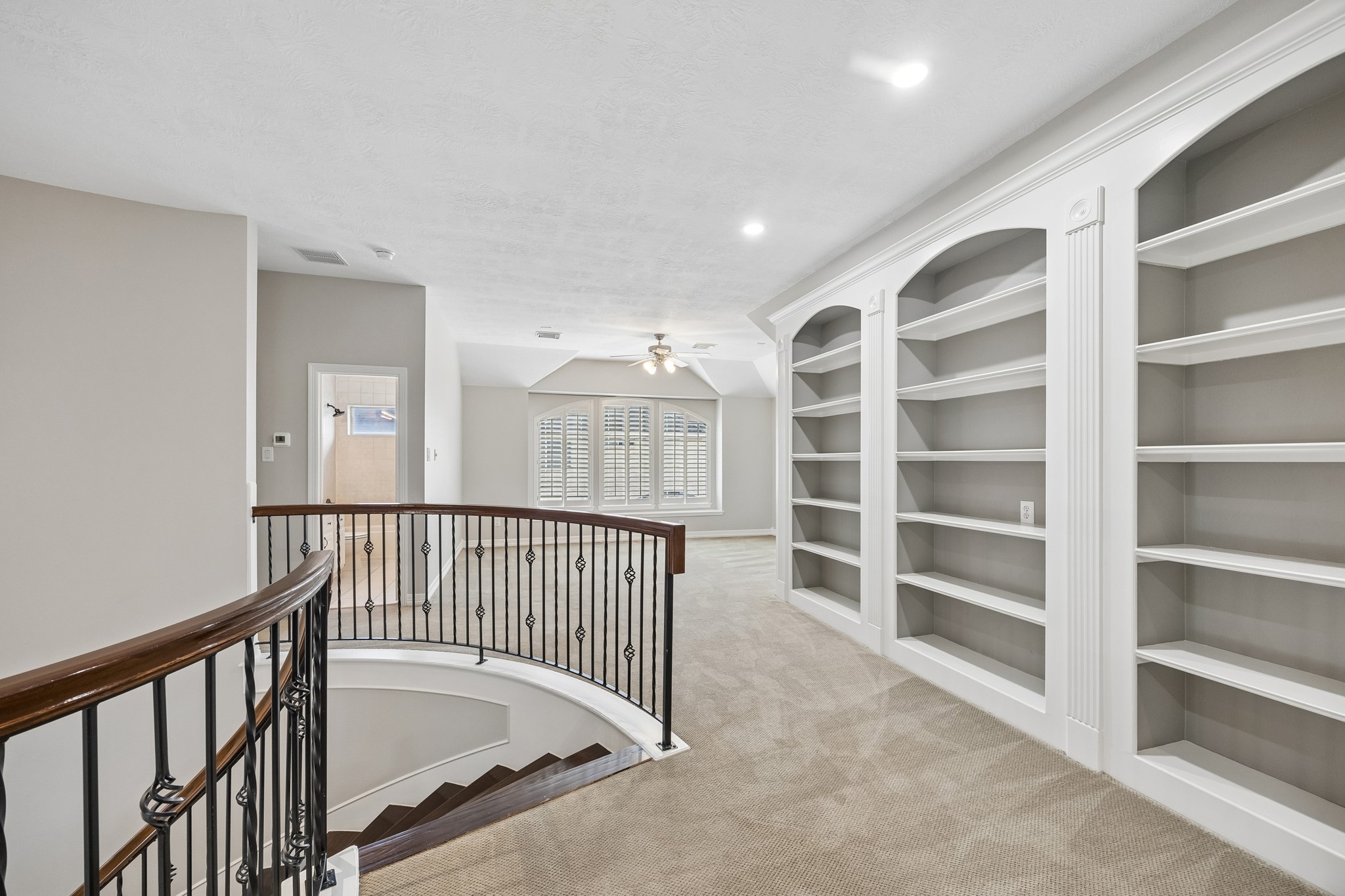6331 Collina Springs Court Houston, TX 77041 - Photo 21 of 34 a view of a hallway with seating area
