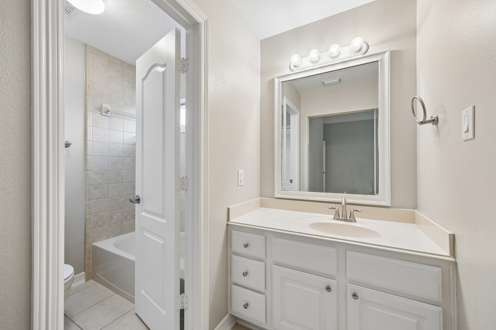 6331 Collina Springs Court Houston, TX 77041 - Photo 26 of 34 a bathroom with a double vanity sink mirror and shower