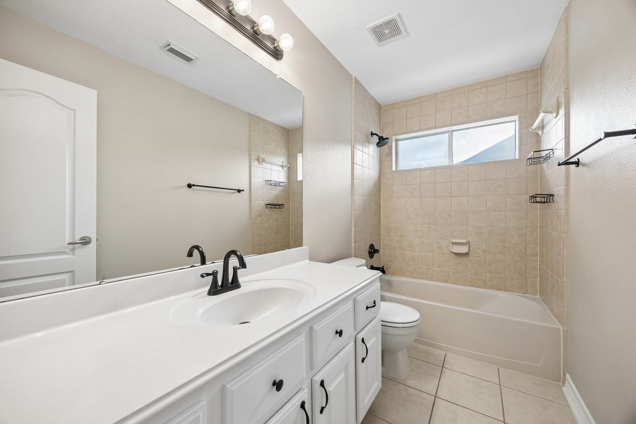 6331 Collina Springs Court Houston, TX 77041 - Photo 27 of 34 a bathroom with a sink a toilet and shower