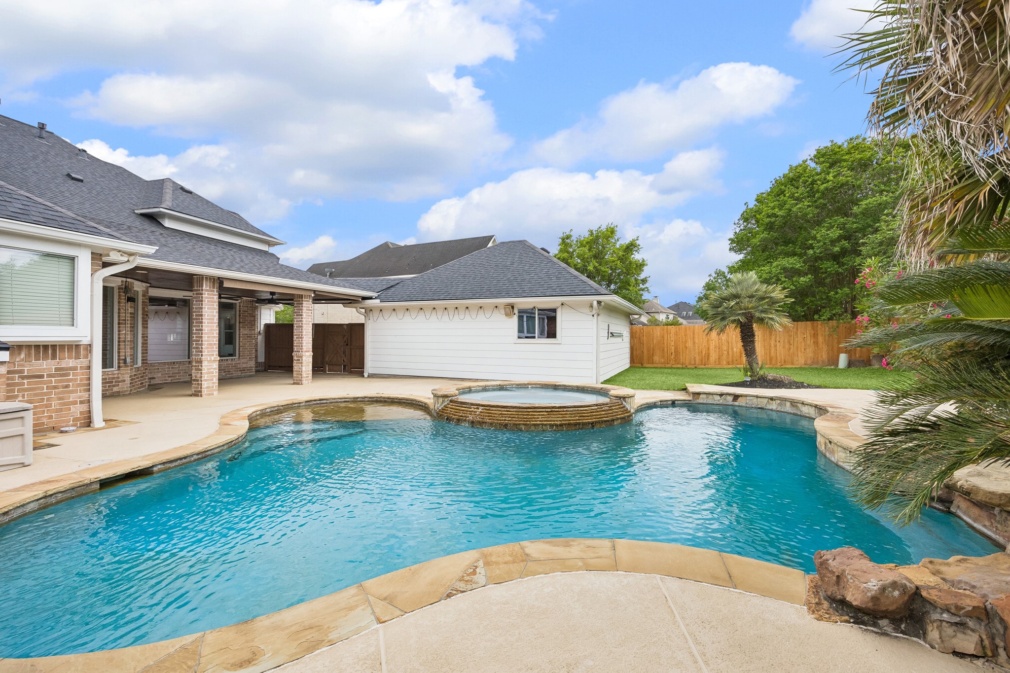 6331 Collina Springs Court Houston, TX 77041 - Photo 31 of 34 a view of a house with swimming pool and sitting area