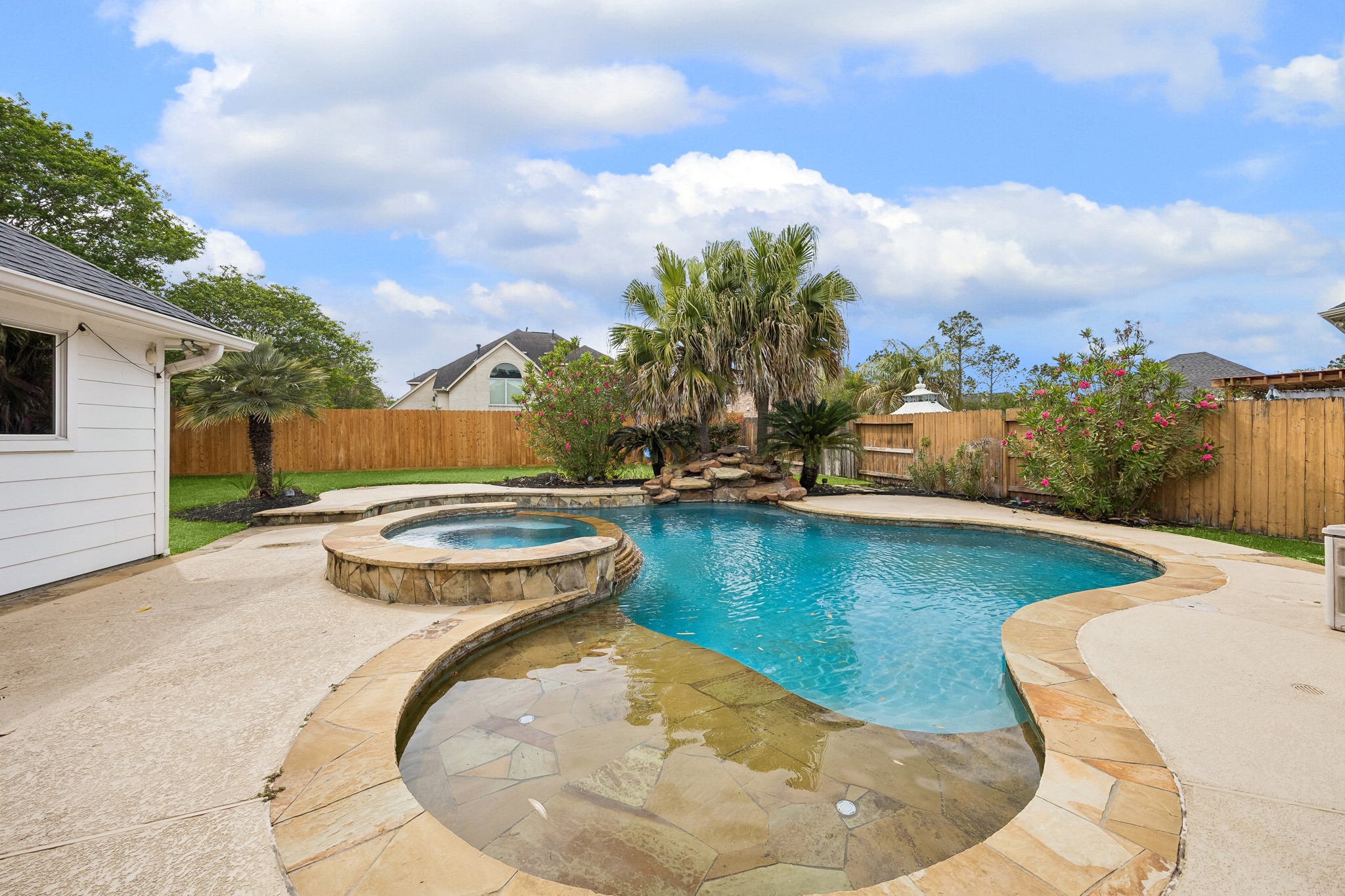 6331 Collina Springs Court Houston, TX 77041 - Photo 32 of 34 a view of a swimming pool with outdoor seating and plants