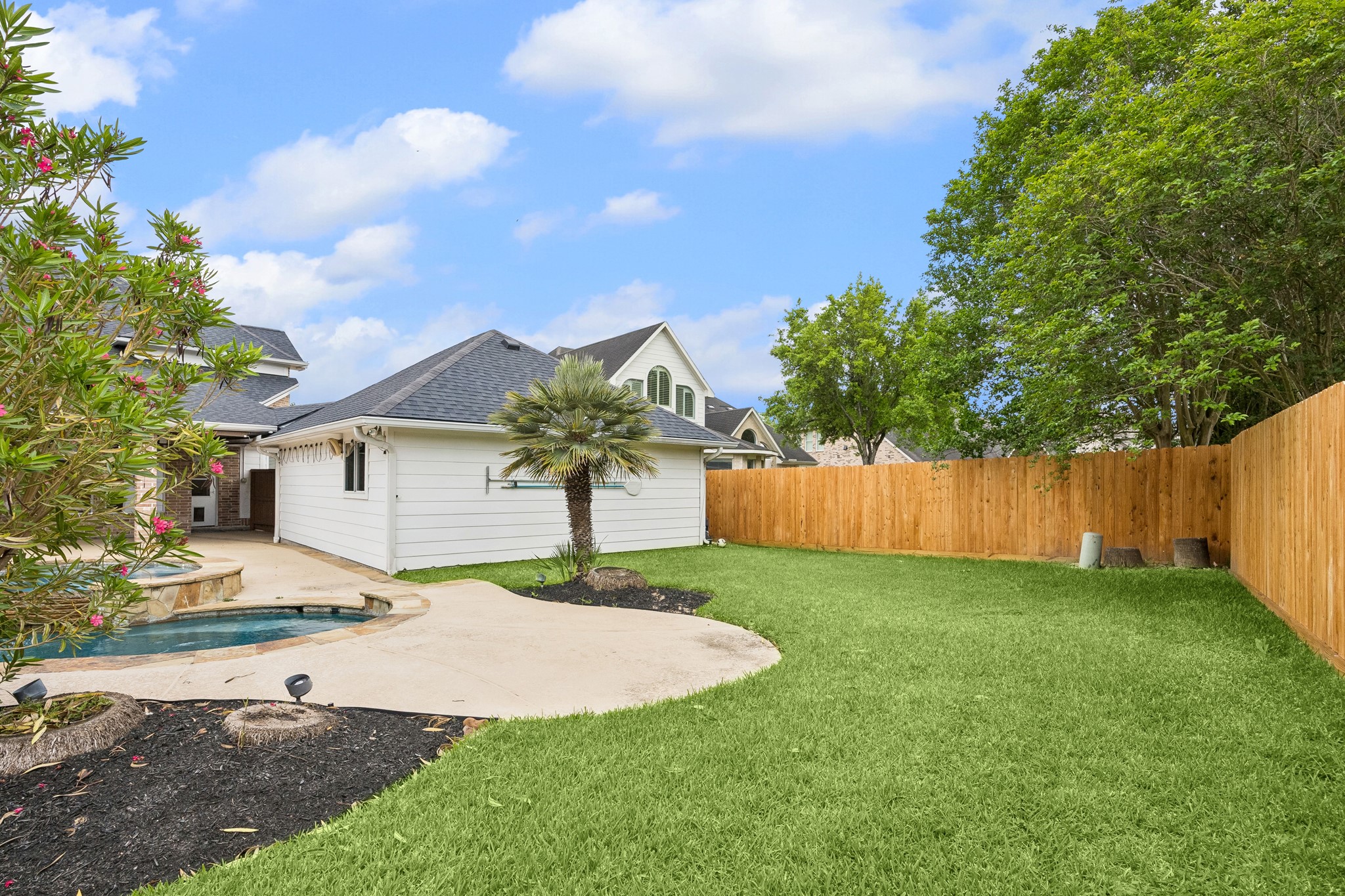 6331 Collina Springs Court Houston, TX 77041 - Photo 33 of 34 a view of a house with a yard and fence