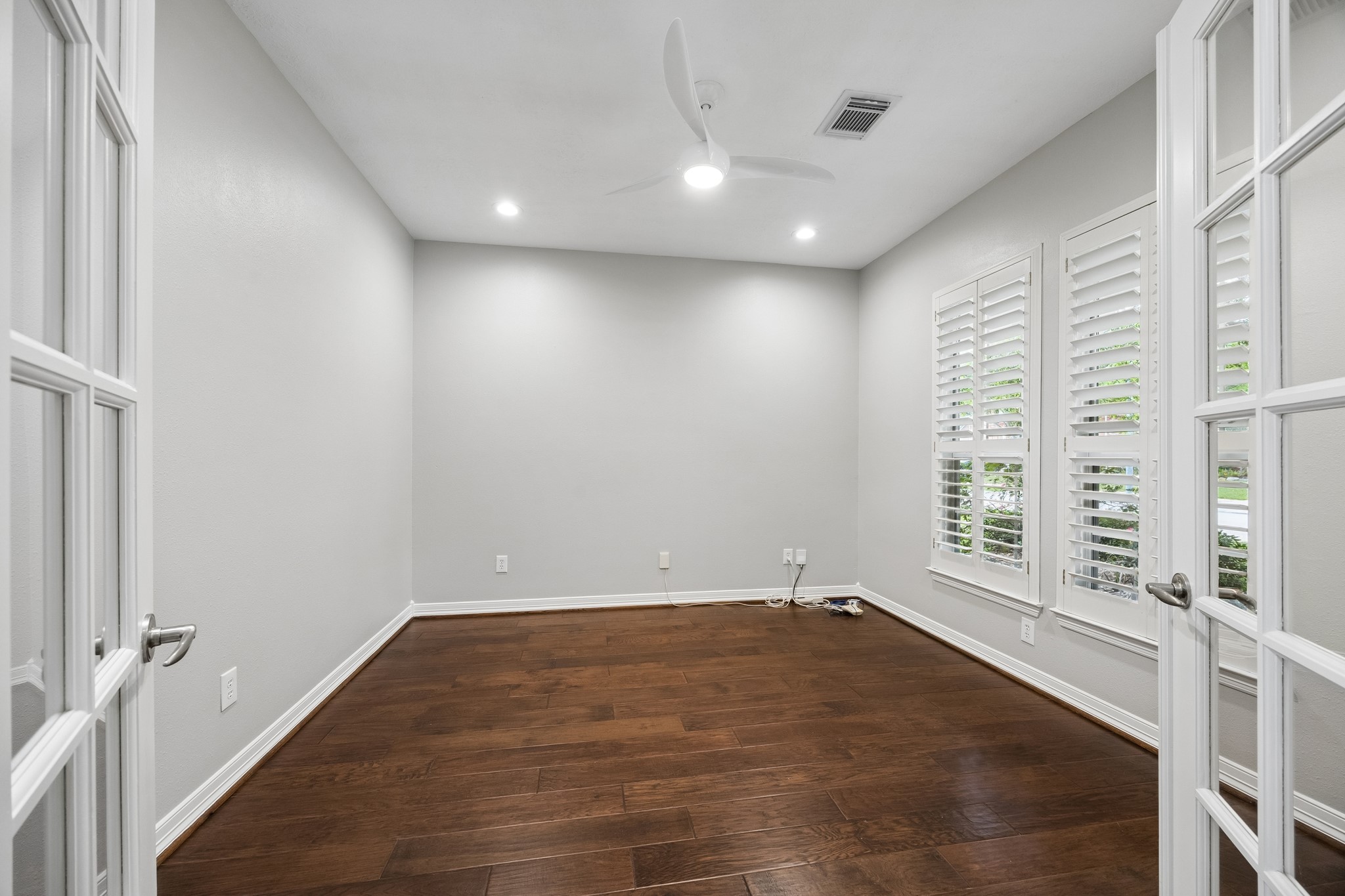 6331 Collina Springs Court Houston, TX 77041 - Photo 5 of 34 a view of empty room with wooden floor and fan