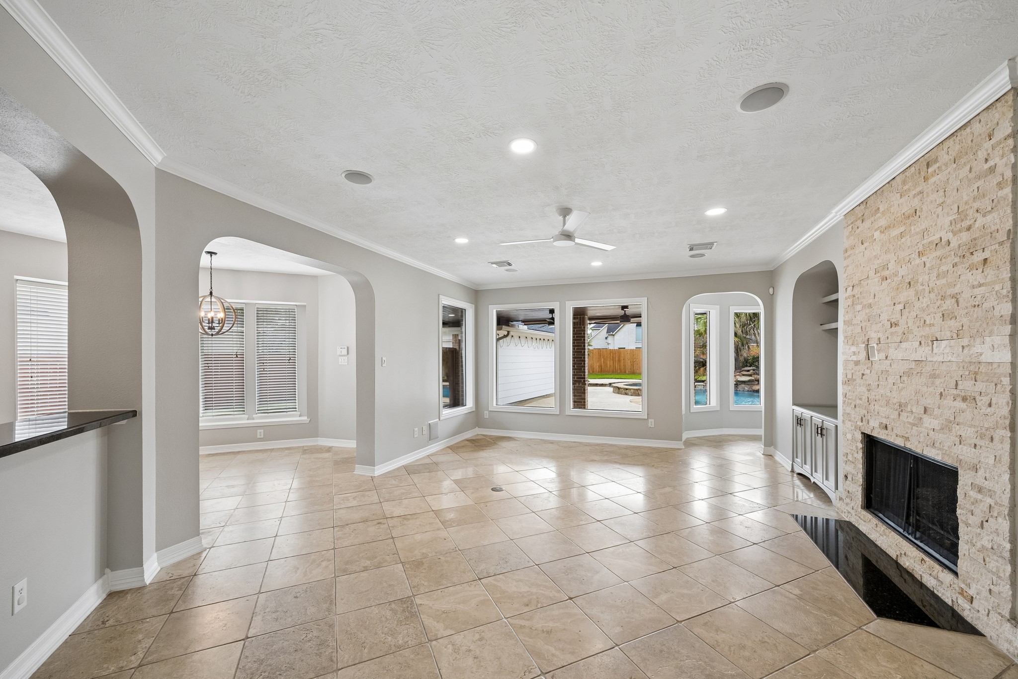 6331 Collina Springs Court Houston, TX 77041 - Photo 8 of 34 a view of an empty room with a fireplace and a window