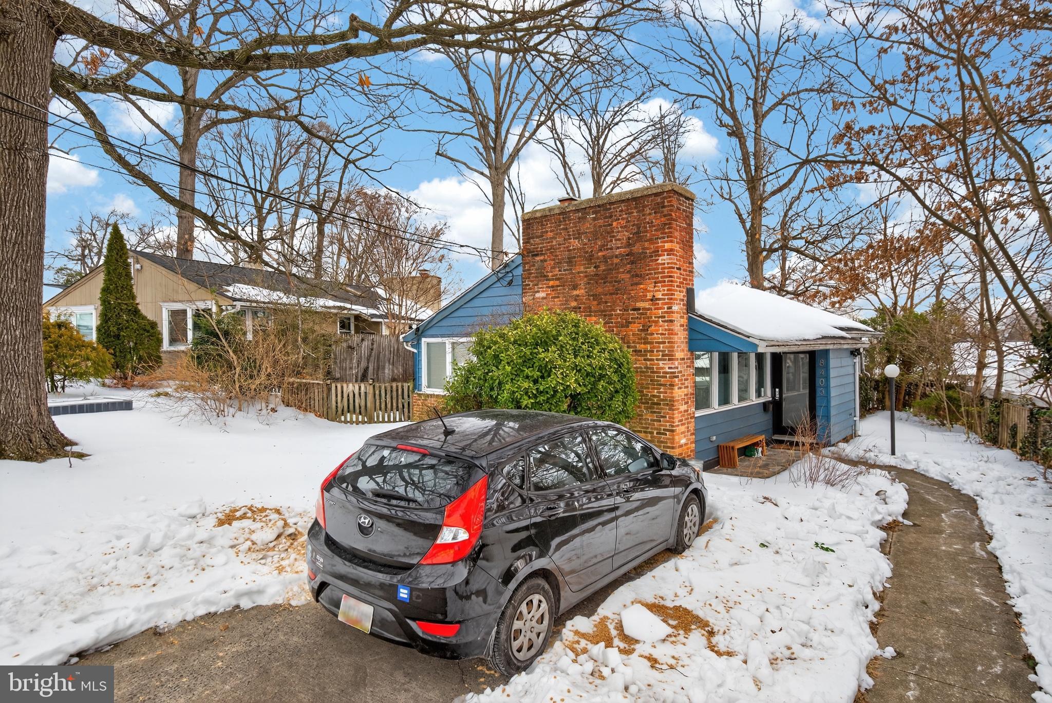 8403 Tahona Drive Silver Spring, MD 20903 - Photo 24 of 29 Charming home nestled in a winter landscape.