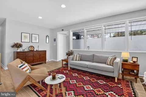 a living room with furniture and a table
