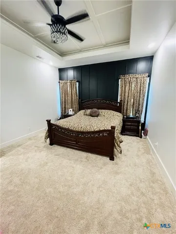 a bed sitting in a room next to a window