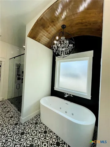 a bathroom with a bathtub and a toilet