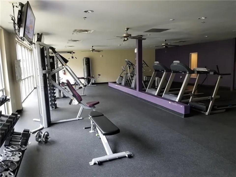 1100 West Trinity Mills Road, Unit 2025 Carrollton, TX 75006 - Photo 14 of 16 a view of a room with gym equipment