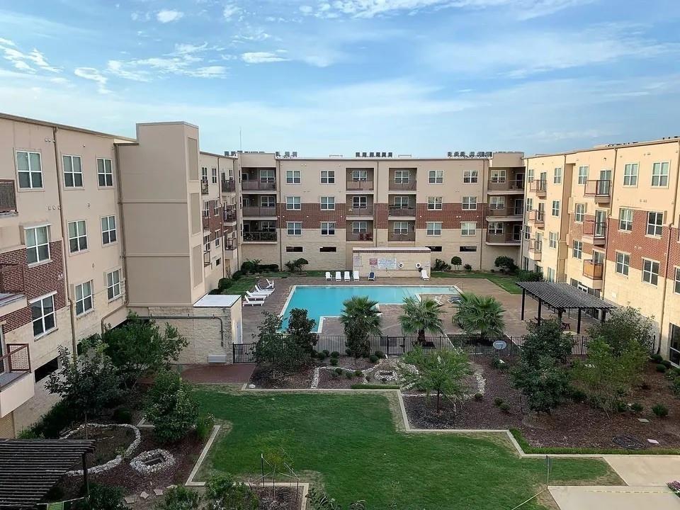 1100 West Trinity Mills Road, Unit 2025 Carrollton, TX 75006 - Photo 2 of 16 a view of a city with tall buildings