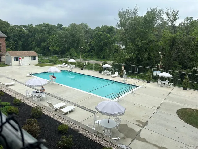 a outdoor space with swimming pool and furniture