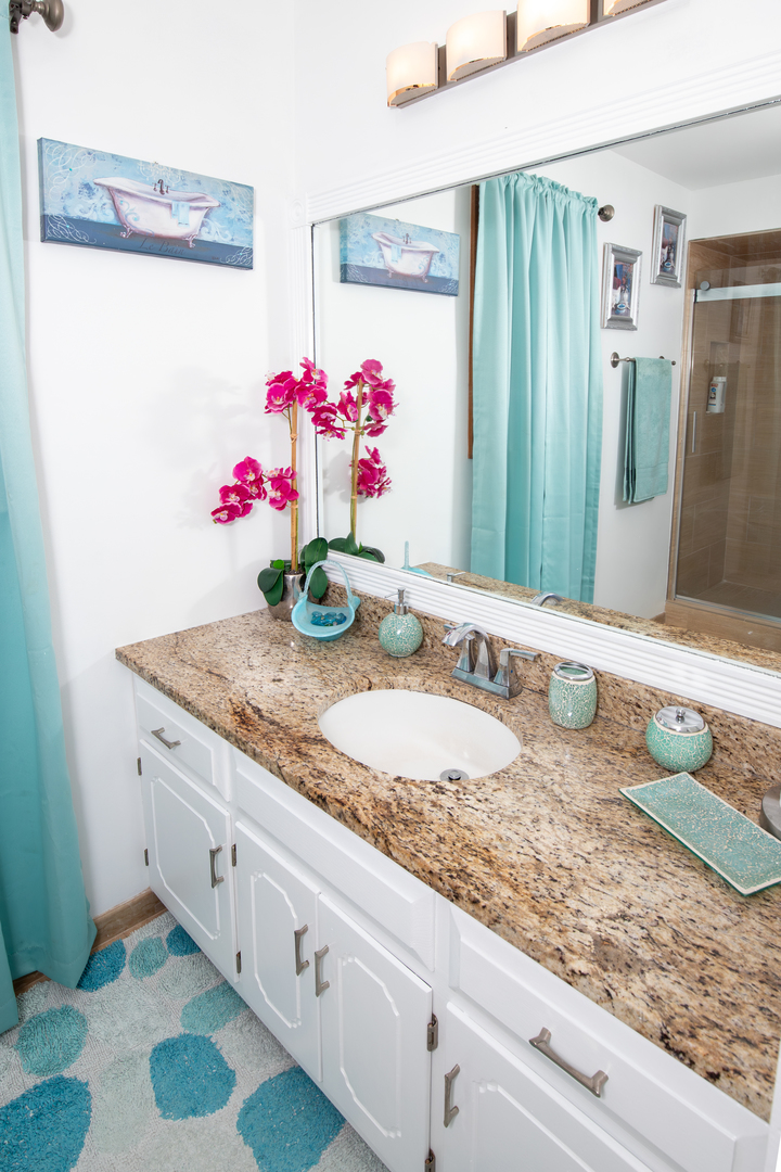 1844 180th Place Lansing, IL 60438 - Photo 12 of 34 a bathroom with a granite countertop sink and a mirror