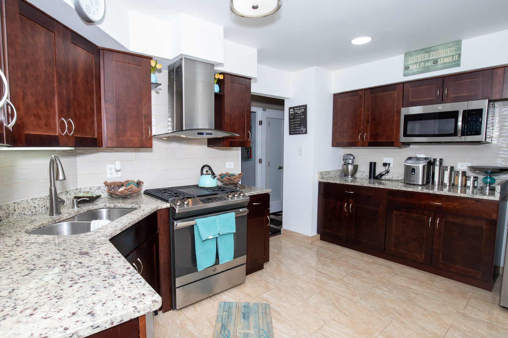 1844 180th Place Lansing, IL 60438 - Photo 6 of 34 a kitchen with stainless steel appliances granite countertop a stove a sink and a microwave