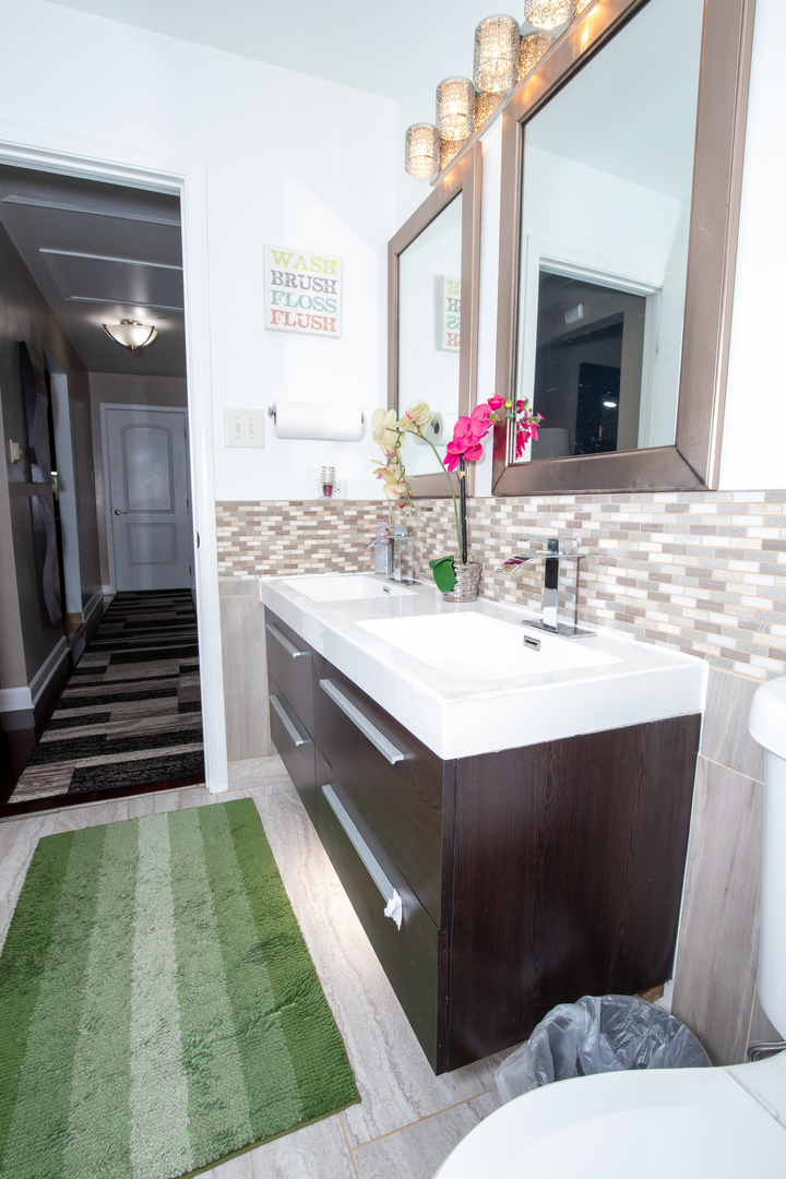 1844 180th Place Lansing, IL 60438 - Photo 8 of 34 a bathroom with a sink and a mirror