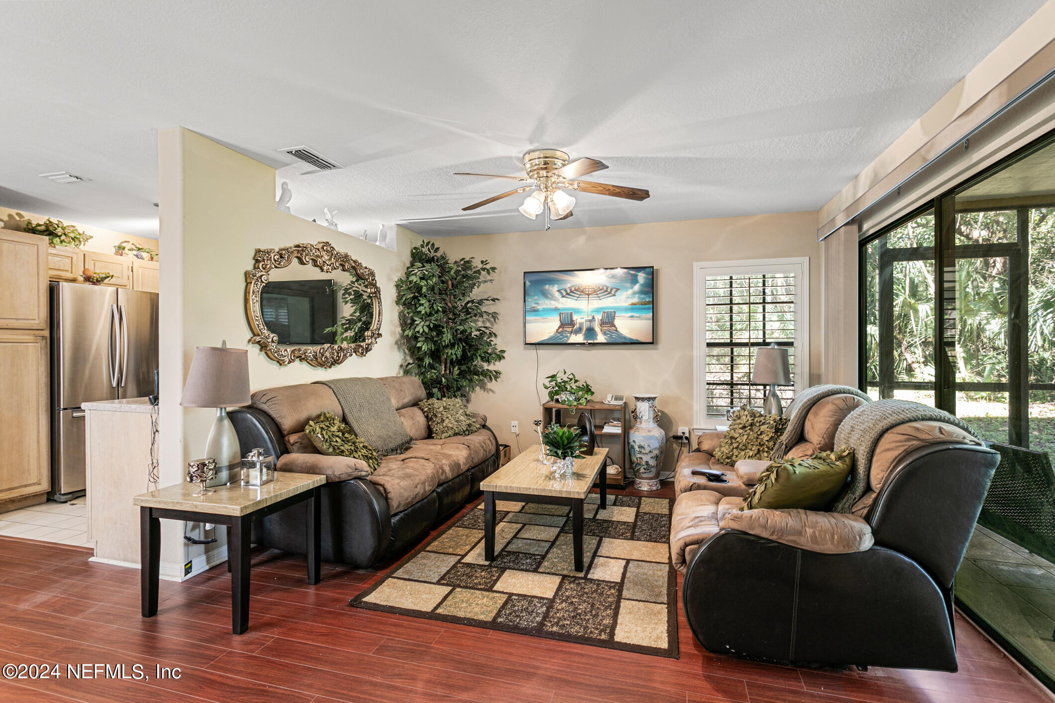 10150 Belle Rive Boulevard, Unit 2605 Jacksonville, FL 32256 - Photo 13 of 52 a living room with furniture and a large window
