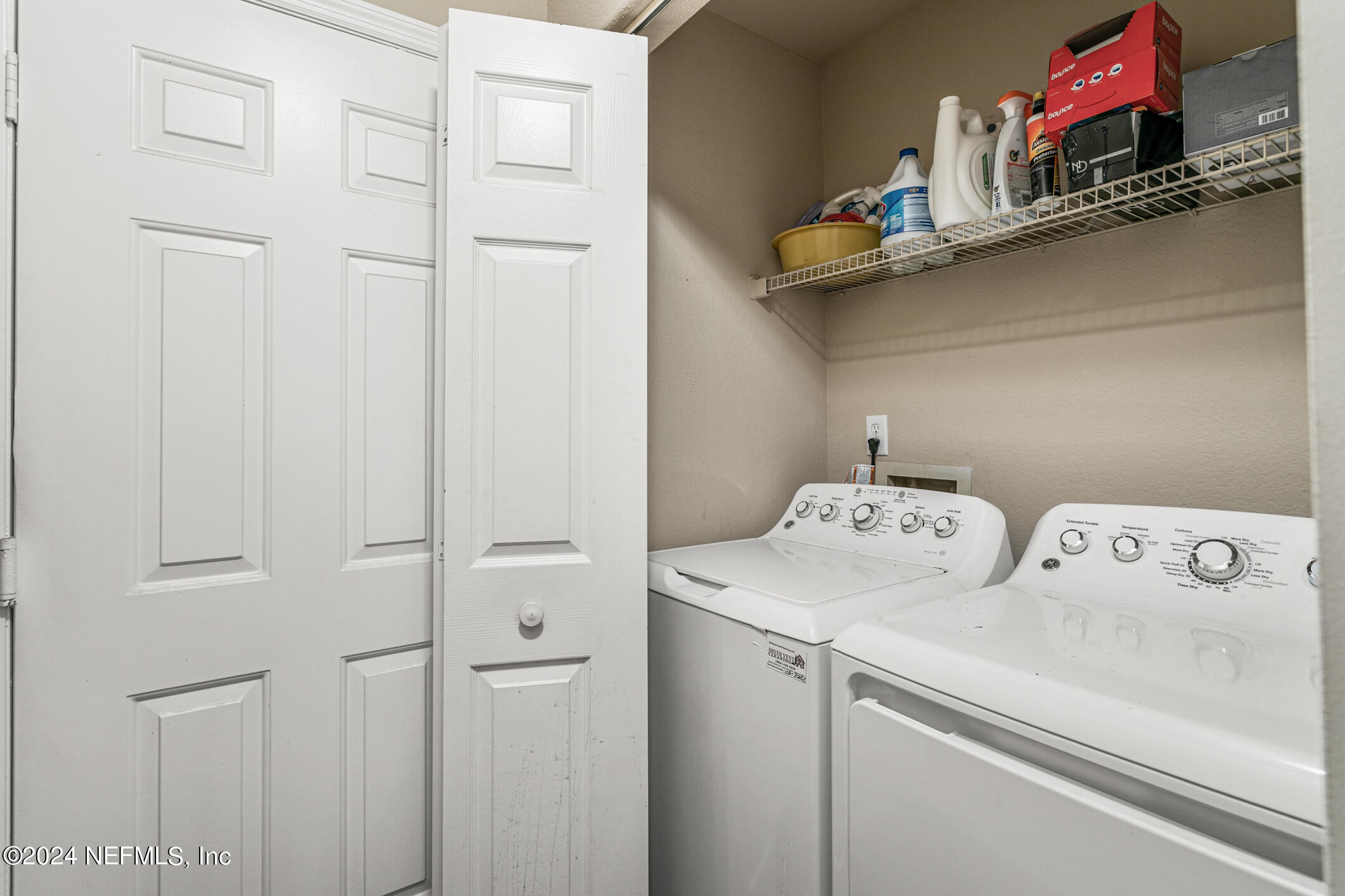 10150 Belle Rive Boulevard, Unit 2605 Jacksonville, FL 32256 - Photo 24 of 52 a utility room with dryer and washer