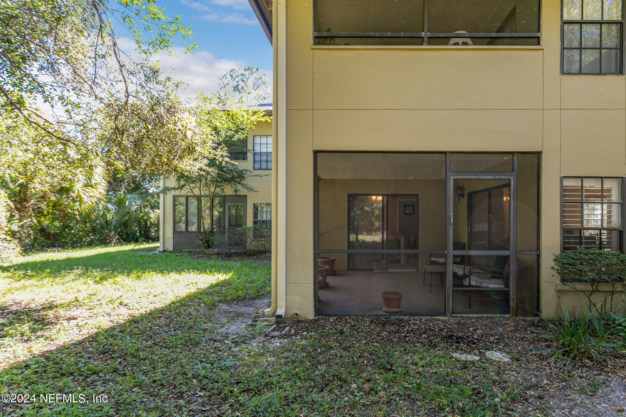 10150 Belle Rive Boulevard, Unit 2605 Jacksonville, FL 32256 - Photo 33 of 52 a view of a door in front of a house with a yard