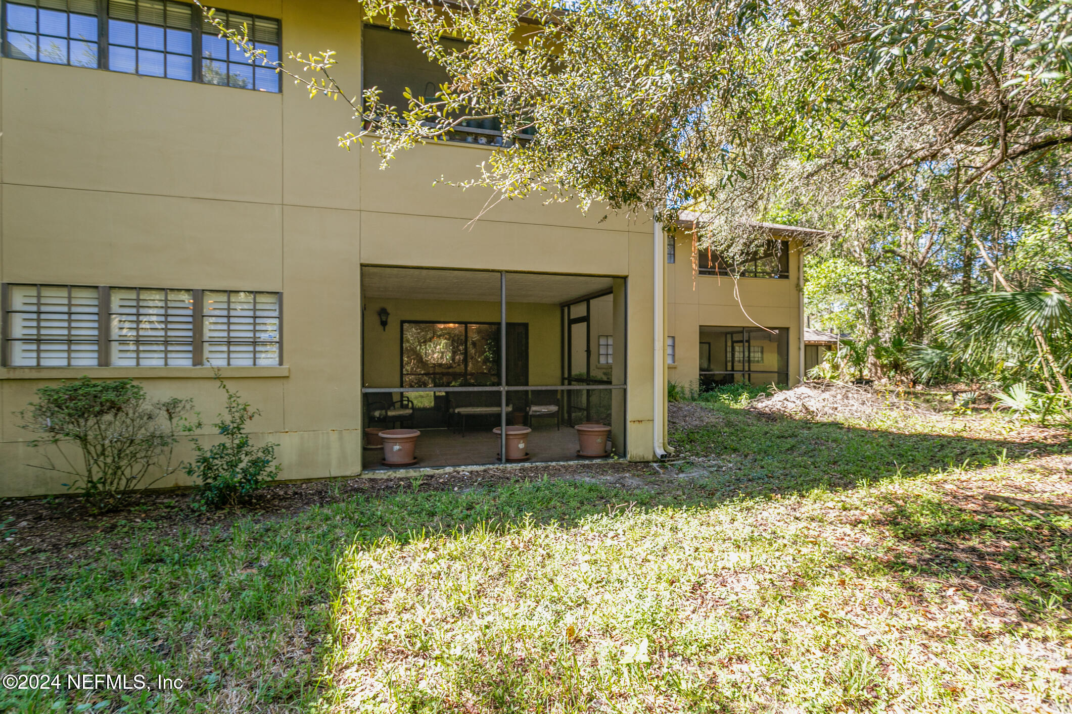 10150 Belle Rive Boulevard, Unit 2605 Jacksonville, FL 32256 - Photo 34 of 52 a view of a house with a yard