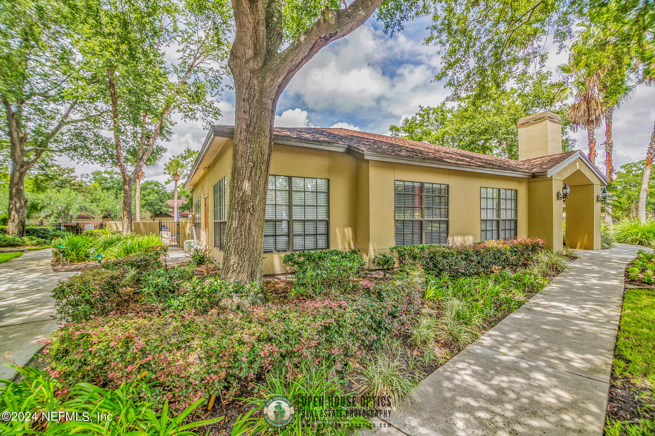10150 Belle Rive Boulevard, Unit 2605 Jacksonville, FL 32256 - Photo 43 of 52 front view of a house with a garden