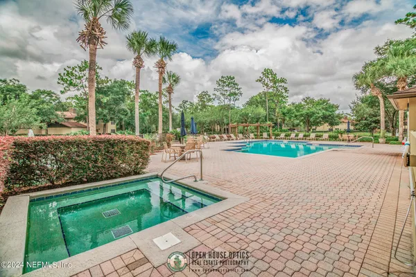 a view of a swimming pool with a yard