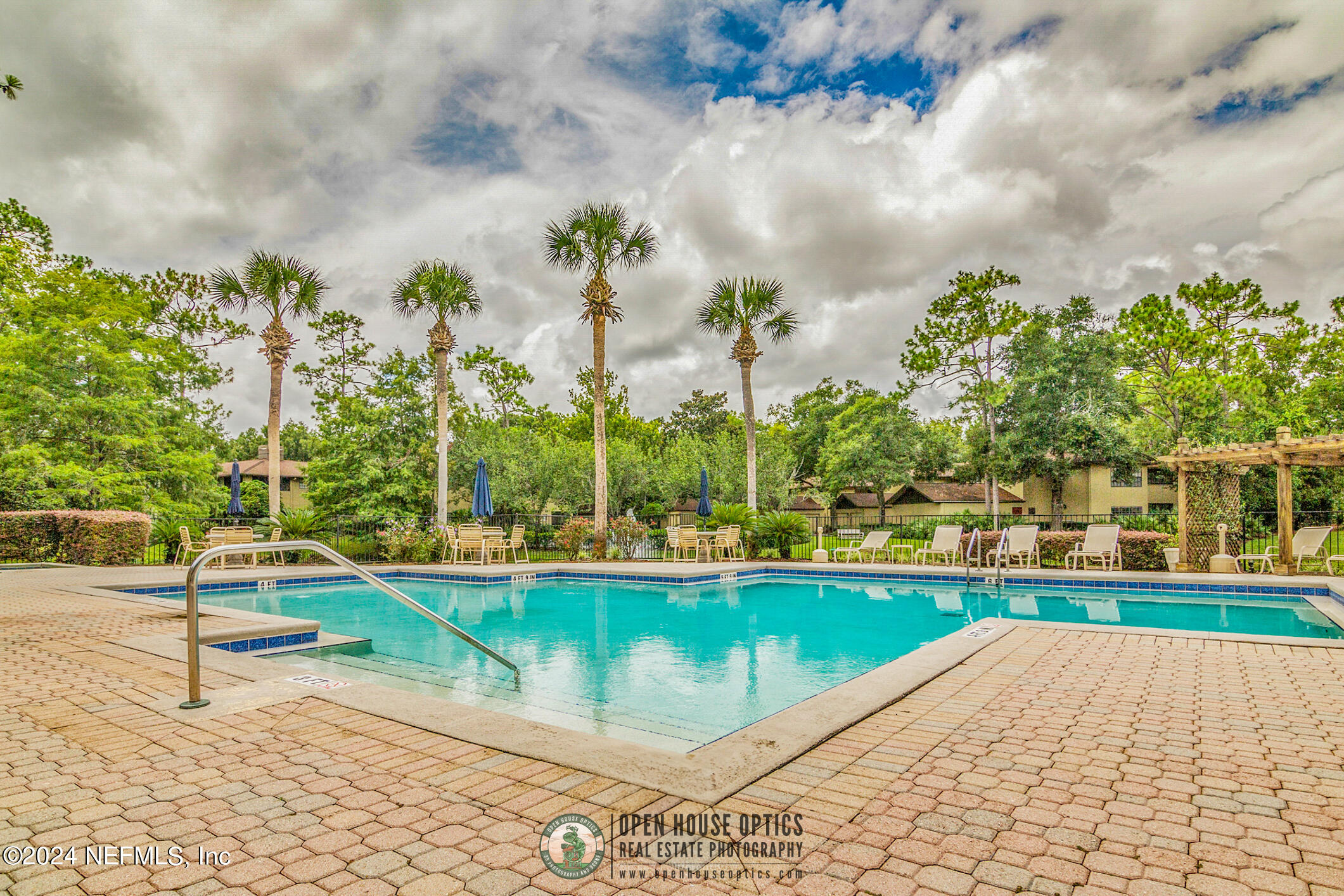 10150 Belle Rive Boulevard, Unit 2605 Jacksonville, FL 32256 - Photo 46 of 52 a view of a swimming pool with a yard