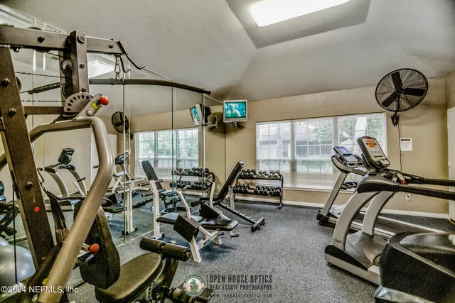 a view of gym equipment with windows