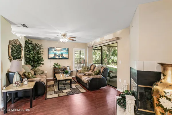 a living room with furniture and a fireplace