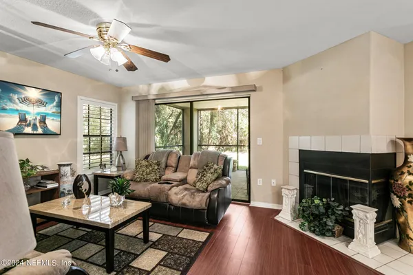 a living room with furniture and a large window
