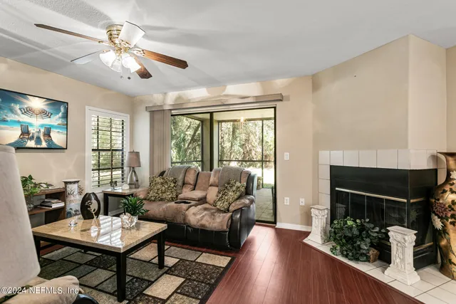 a living room with furniture and a large window