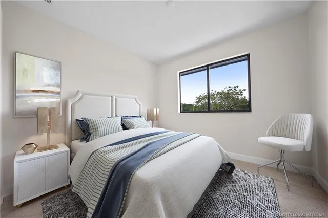 a bedroom with a bed and a chair