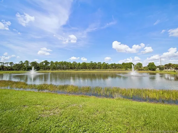 a view of a lake with a building in the background