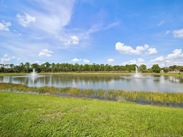 a view of a lake with a building in the background